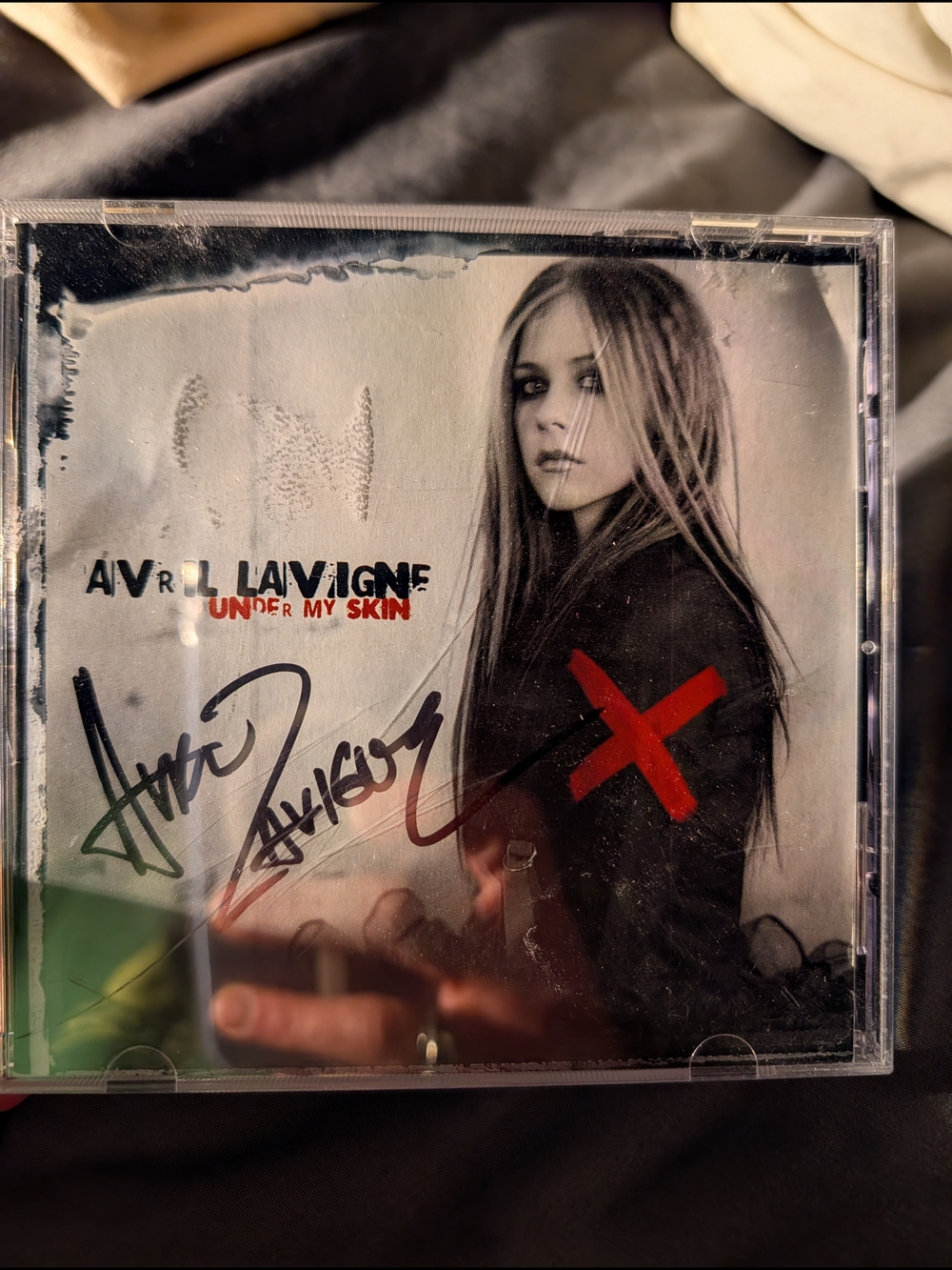 Signed Avril Lavigne "Under My Skin" CD - Black & White with Red Accent